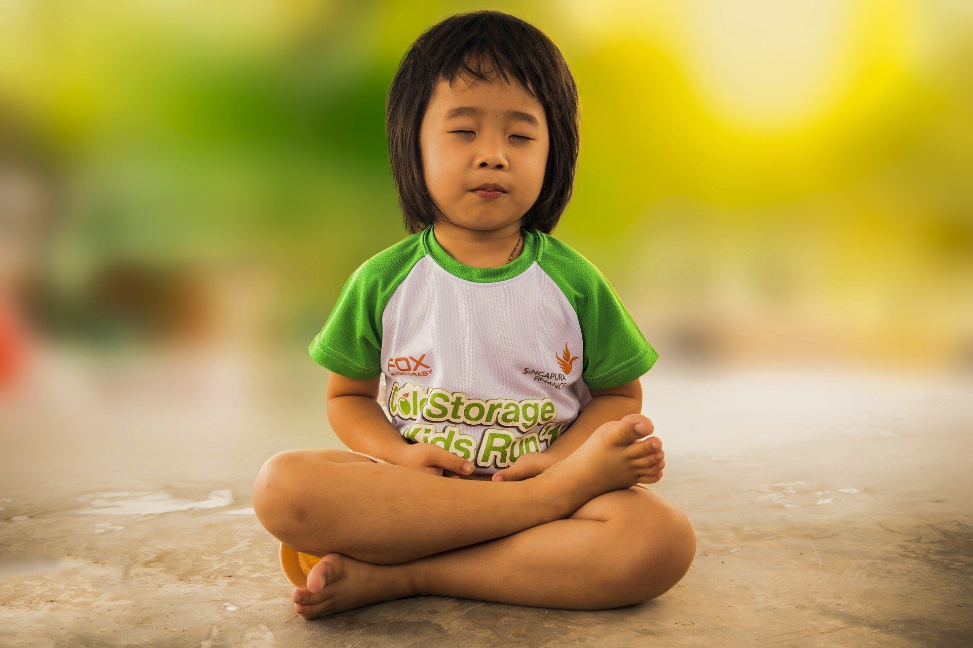 Young girl sitting and meditating