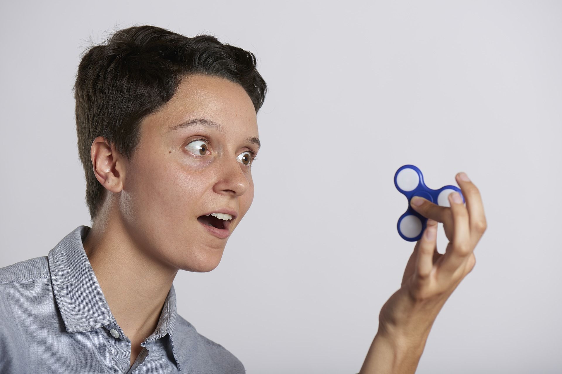 Person with fidget spinner not focused on study