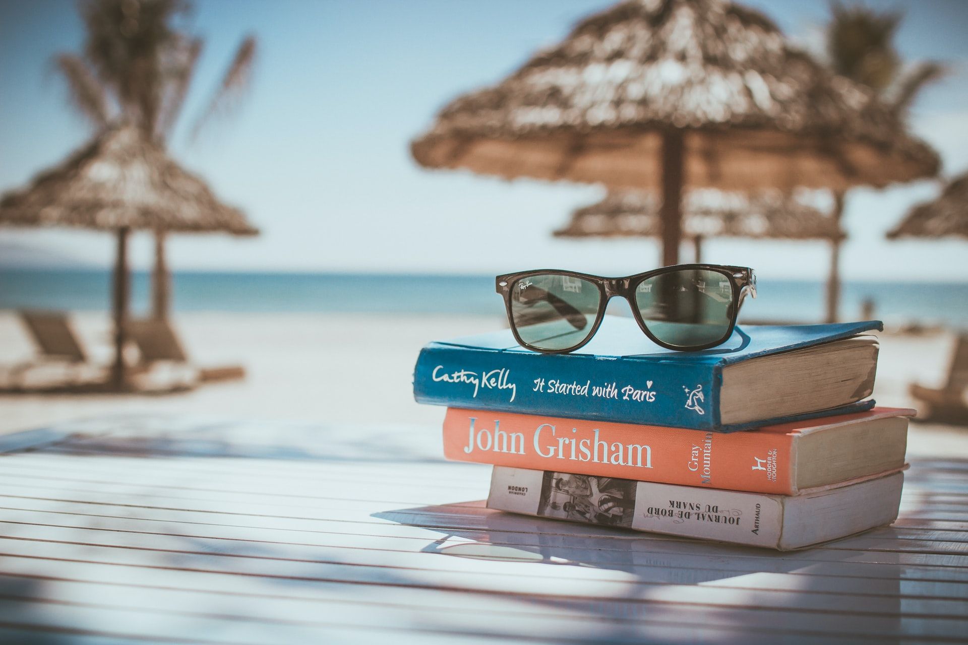 Books and sunglasses beach, summer studying